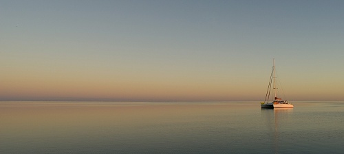 Boat in sea sunset